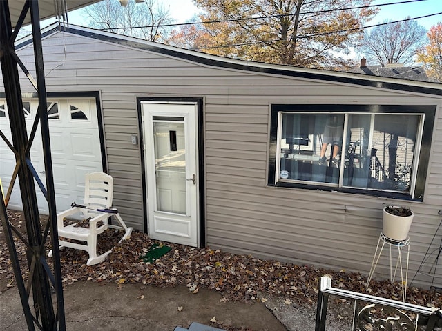 view of exterior entry featuring a garage