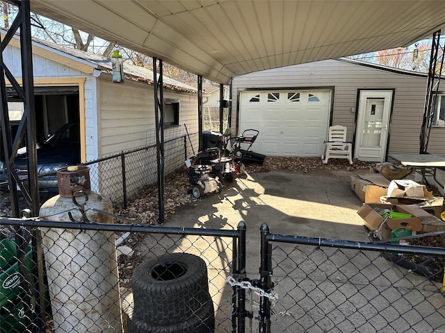 view of patio / terrace featuring an outbuilding and a garage