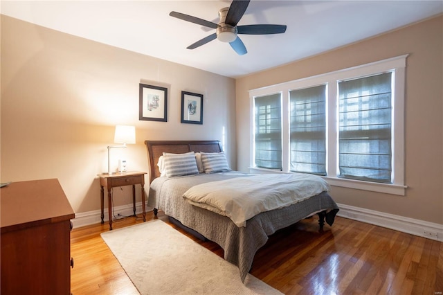 bedroom featuring ceiling fan and light hardwood / wood-style flooring