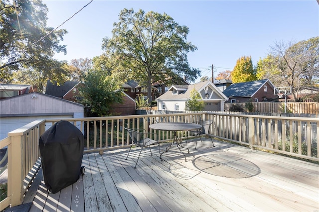 deck with a garage and grilling area