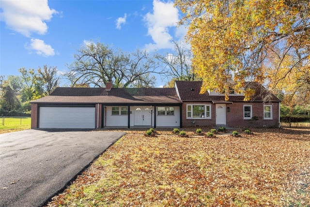 single story home featuring a garage