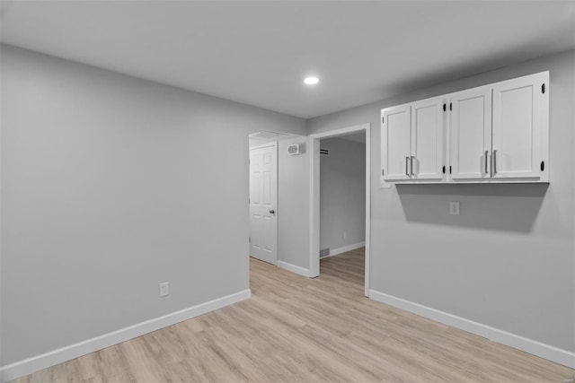 empty room with light wood-type flooring