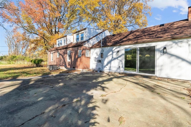 back of property with a patio