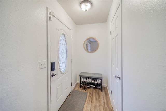 entryway with light hardwood / wood-style floors