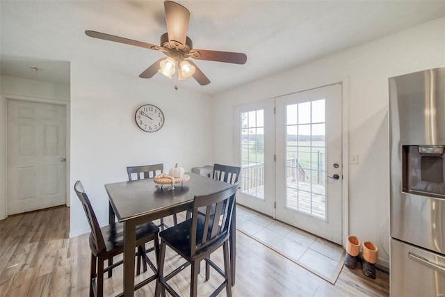 dining space featuring light hardwood / wood-style flooring and ceiling fan