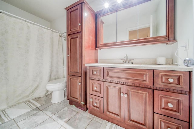 bathroom with toilet and vanity