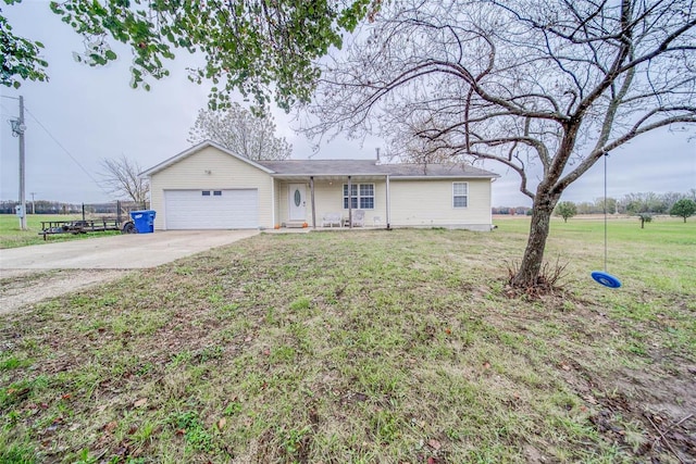 ranch-style home featuring a front yard and a garage