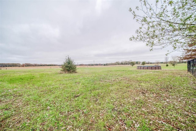 view of yard with a rural view