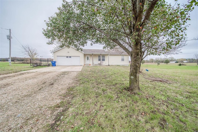 ranch-style home with a front lawn and a garage