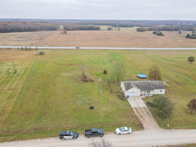 birds eye view of property with a rural view