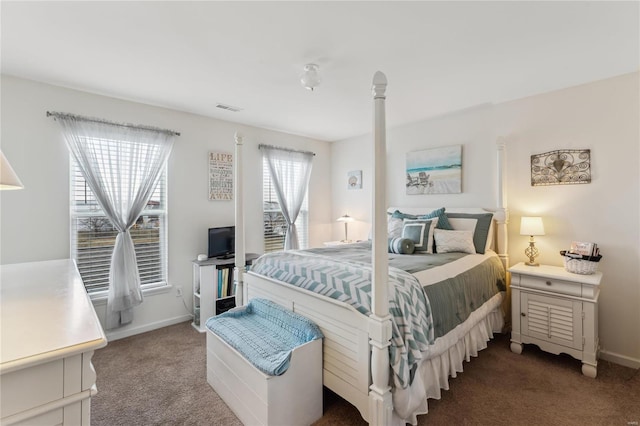 bedroom with visible vents, carpet floors, and baseboards