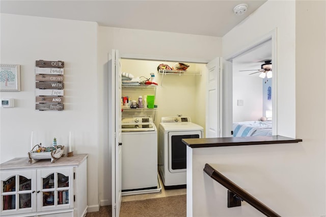 washroom featuring laundry area and separate washer and dryer