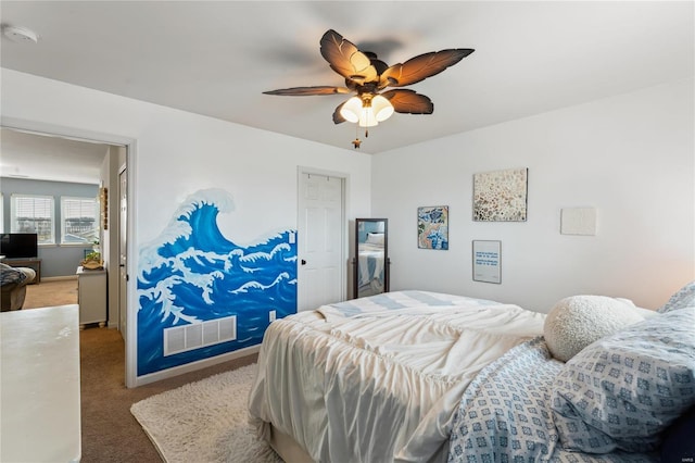 carpeted bedroom featuring visible vents, baseboards, and a ceiling fan