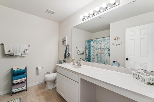 bathroom with visible vents, toilet, vanity, and baseboards