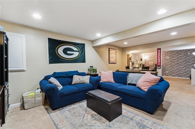 carpeted living area featuring recessed lighting and baseboards