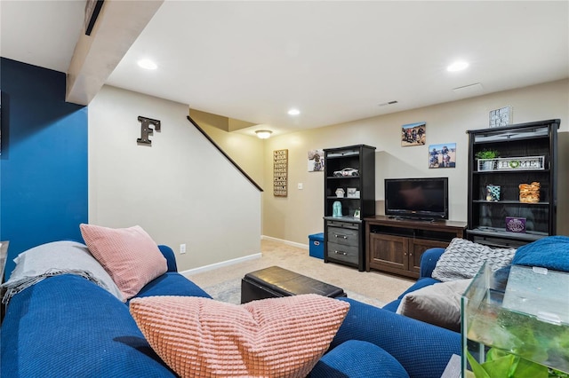 living area featuring recessed lighting, light colored carpet, and baseboards