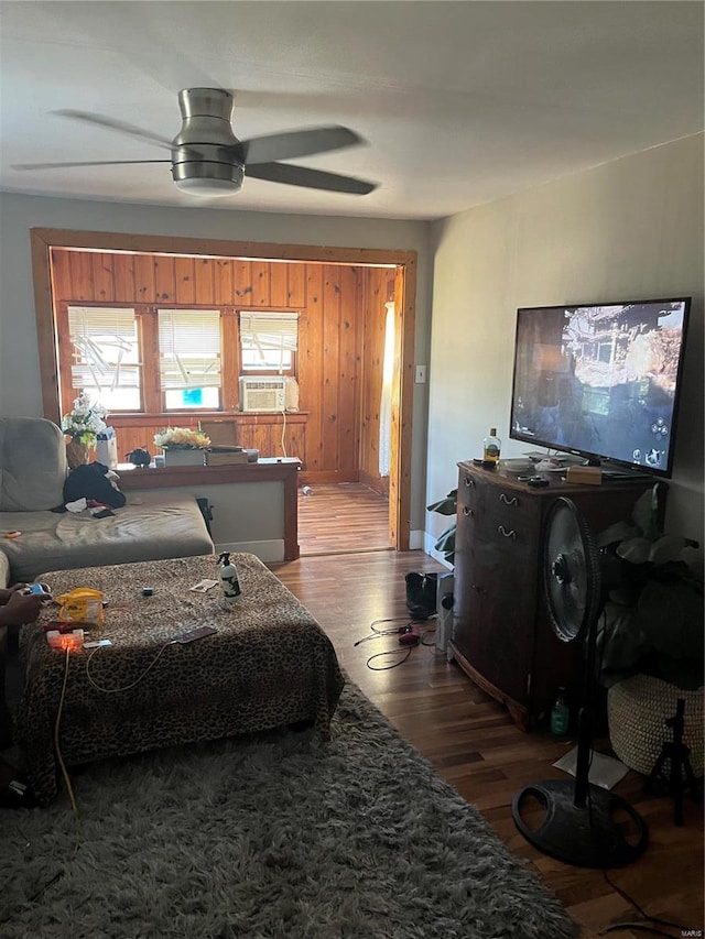 bedroom featuring cooling unit, wood-type flooring, and ceiling fan