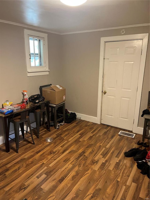 office featuring dark hardwood / wood-style floors and ornamental molding