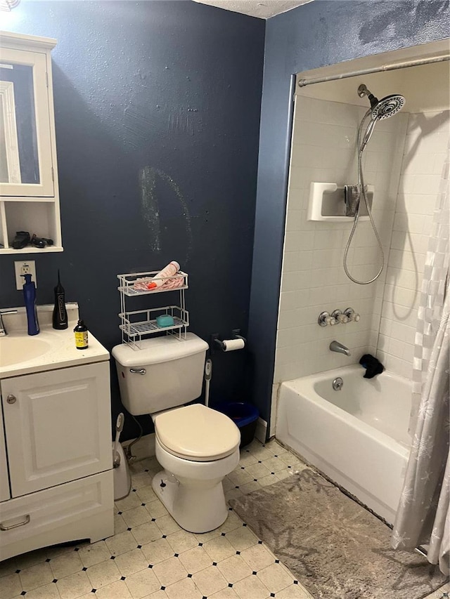 full bathroom with vanity, shower / bath combination with curtain, and toilet