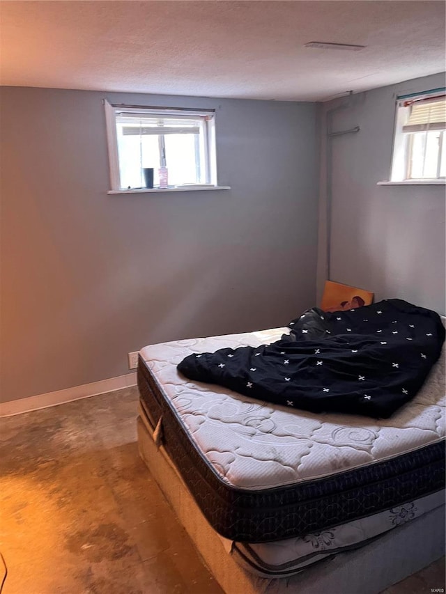 bedroom featuring multiple windows