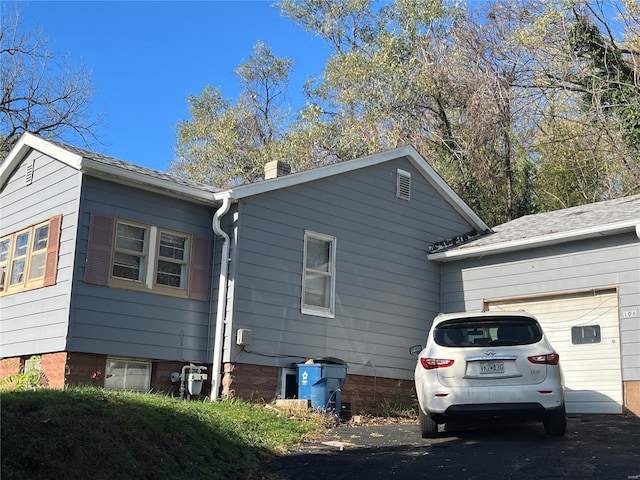 view of property exterior featuring a garage