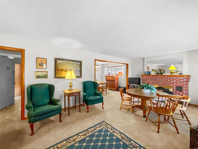 sitting room with a brick fireplace