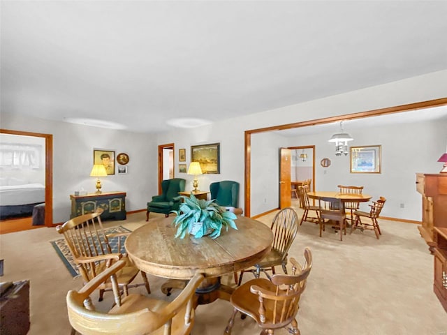 dining area with light colored carpet