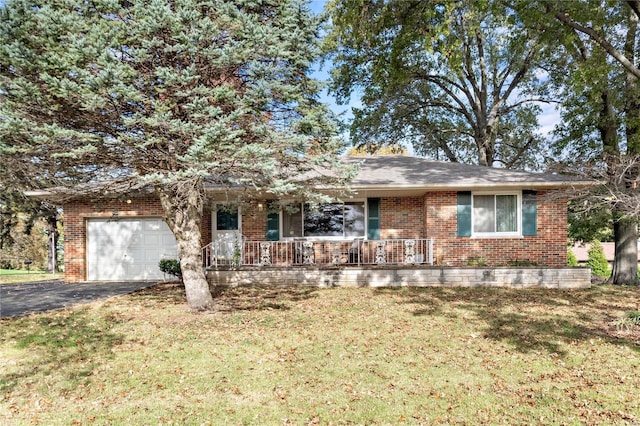 ranch-style home with a garage and a front yard