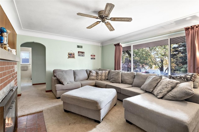 carpeted living room featuring ceiling fan