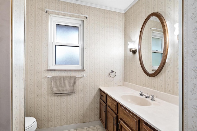 bathroom with toilet, tile patterned flooring, vanity, and crown molding