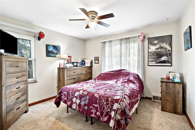 carpeted bedroom with ceiling fan