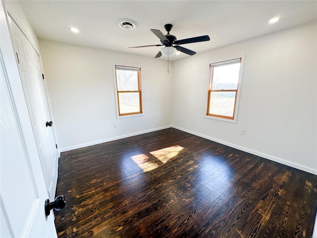 unfurnished bedroom with dark wood-type flooring and ceiling fan