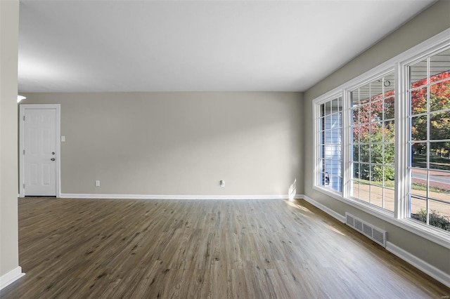 spare room with hardwood / wood-style flooring