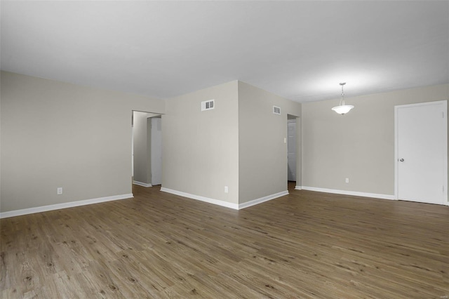 empty room featuring hardwood / wood-style floors