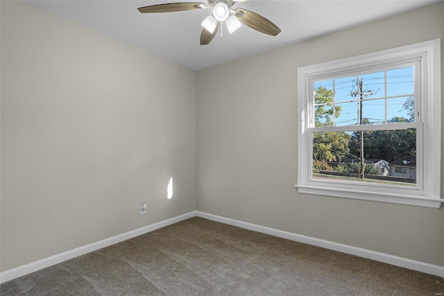 empty room featuring carpet floors and ceiling fan