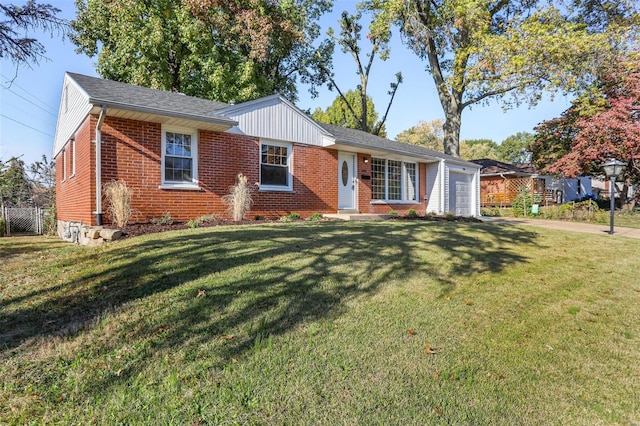 ranch-style home with a garage and a front lawn