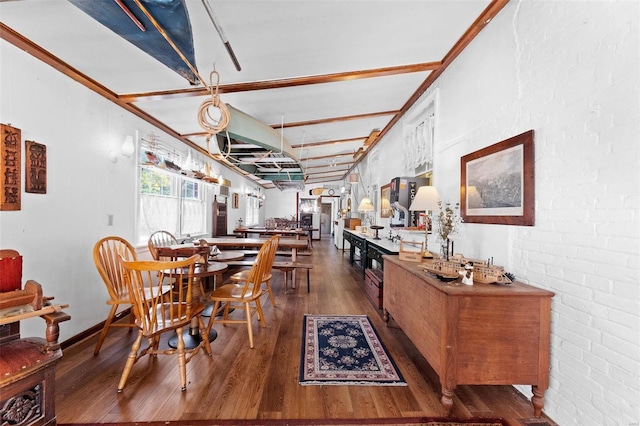 dining area featuring dark wood-type flooring