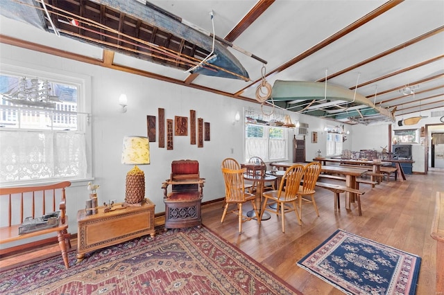 dining space with wood-type flooring