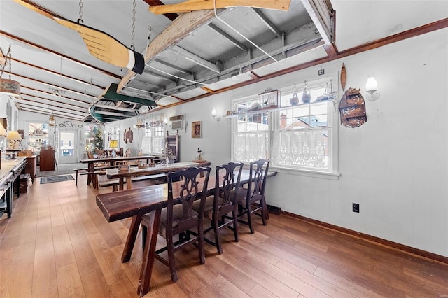 dining area featuring wood-type flooring