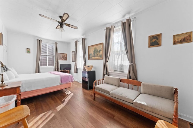 bedroom featuring hardwood / wood-style flooring and ceiling fan