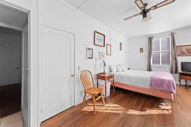 bedroom with hardwood / wood-style flooring and ceiling fan