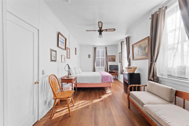 bedroom featuring hardwood / wood-style floors and ceiling fan