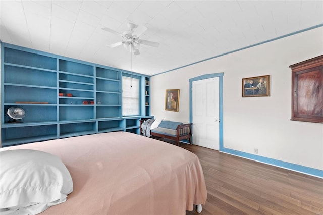 bedroom featuring hardwood / wood-style flooring and ceiling fan