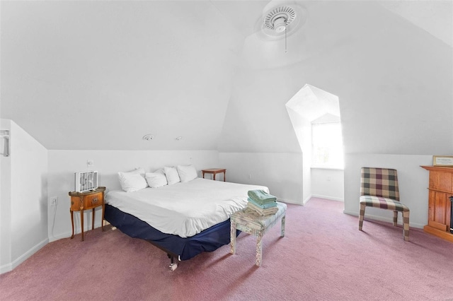 carpeted bedroom featuring vaulted ceiling