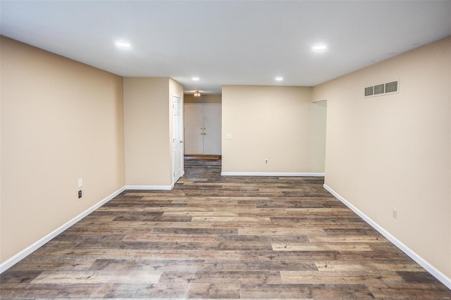 basement featuring dark hardwood / wood-style flooring