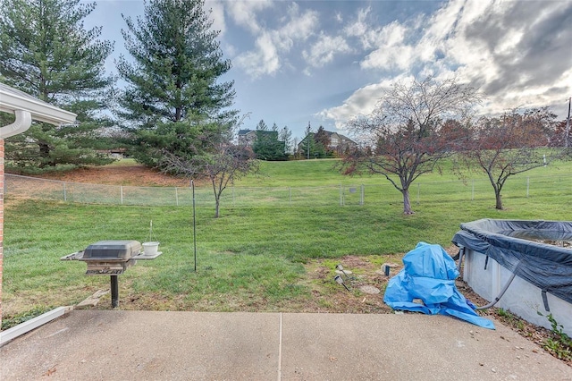 view of yard with a covered pool