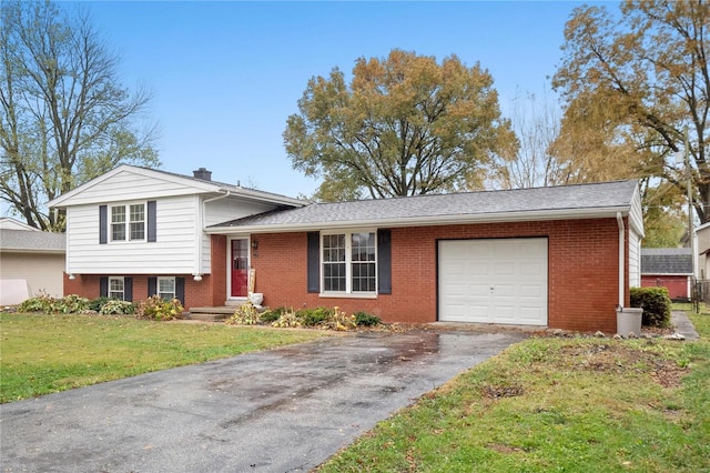 split level home with a garage and a front lawn