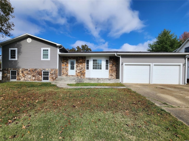 split level home featuring a front yard and a garage