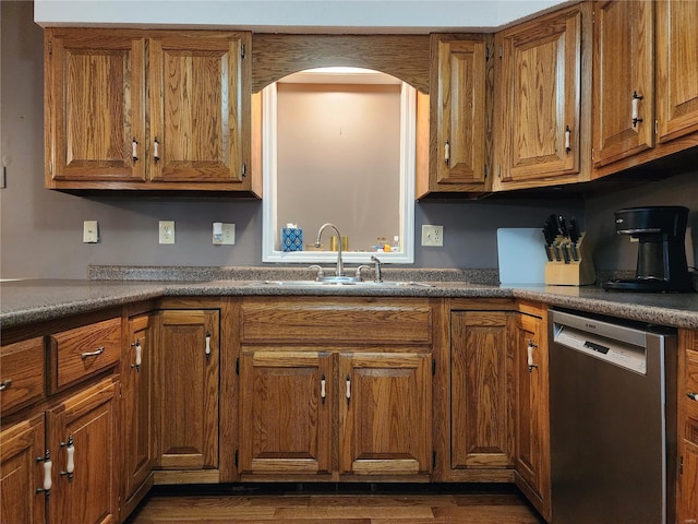 kitchen featuring dishwasher, dark hardwood / wood-style flooring, and sink