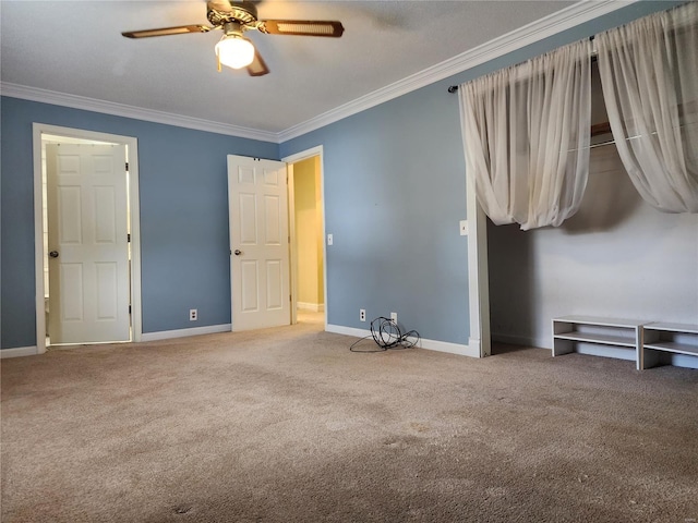 unfurnished bedroom featuring carpet flooring, ceiling fan, and ornamental molding